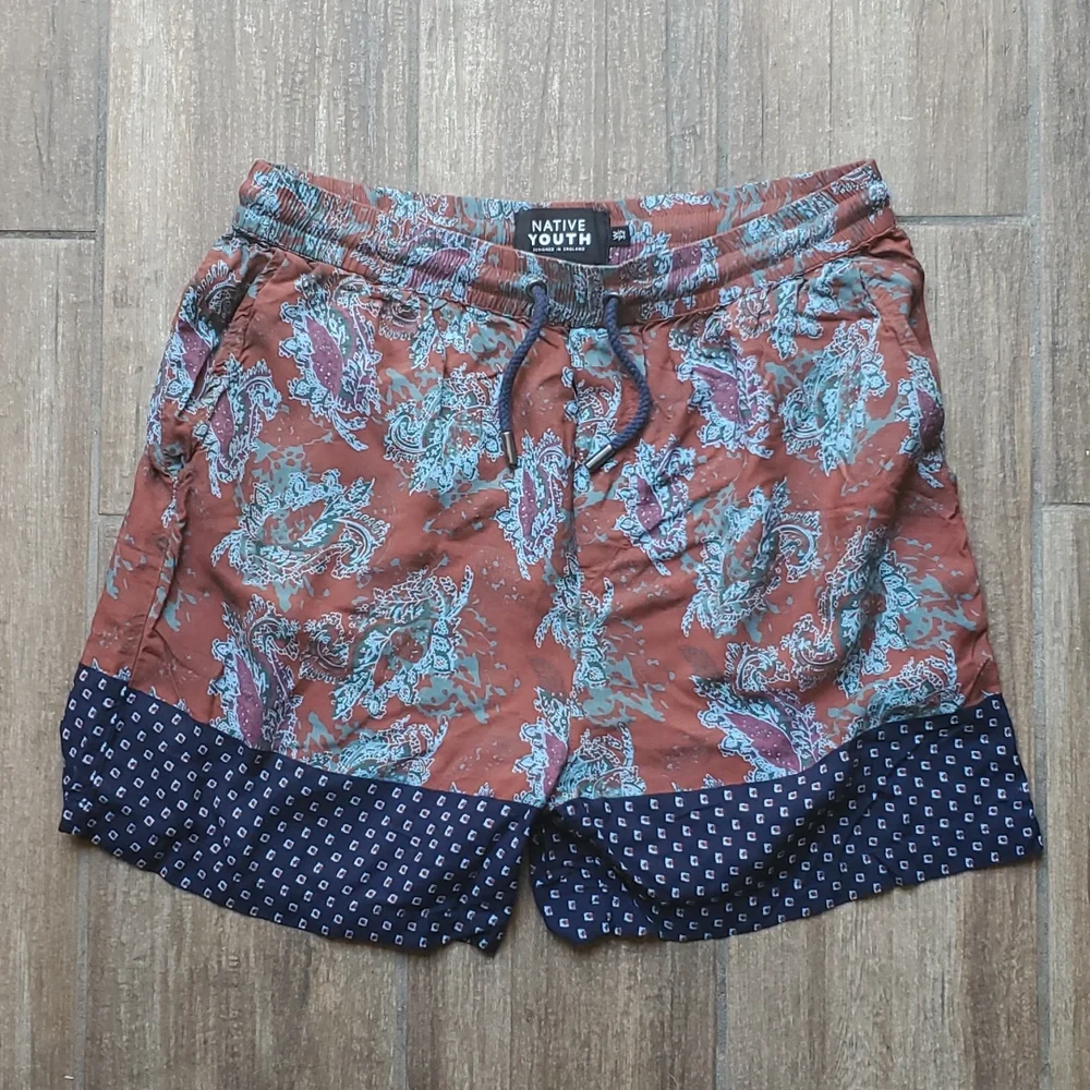 Native Youth Designed in England Paisley Print Volley Shorts.